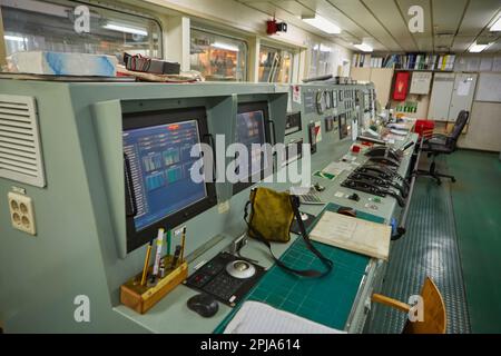Interior of ship's engine room control compartment. The control instruments of the ship's engine. Stock Photo