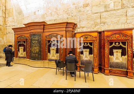 JERUSALEM, ISRAEL - JANUARY 14, 2023: Prayers inside of the Cave Synagogue Stock Photo