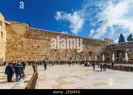 JERUSALEM, ISRAEL - JANUARY 14, 2023: Worshipers praying at the Western or Wailing Wall of Ancient Temple Jerusalem Israel. Judaisim's most holy site Stock Photo