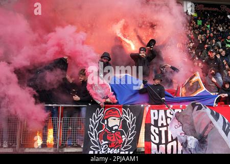 ALKMAAR - Supporters of AZ set off fireworks during the Dutch premier league match between AZ Alkmaar and SC Heerenveen at the AFAS stadium on April 1, 2023 in Alkmaar, Netherlands. ANP ED VAN DE POL Credit: ANP/Alamy Live News Stock Photo