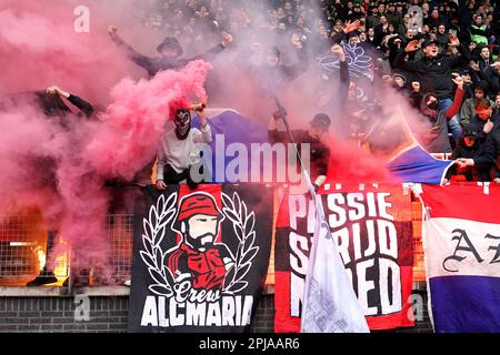 ALKMAAR - Supporters of AZ set off fireworks during the Dutch premier league match between AZ Alkmaar and SC Heerenveen at the AFAS stadium on April 1, 2023 in Alkmaar, Netherlands. ANP ED VAN DE POL Credit: ANP/Alamy Live News Stock Photo