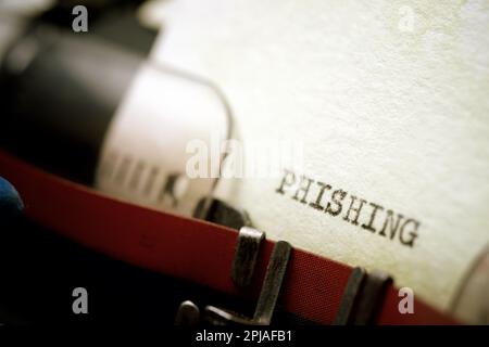 Phishing word written with a typewriter. Stock Photo