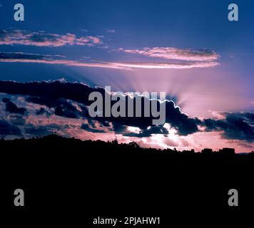 New Zealand. Auckland. Stormy sunset over hills. Stock Photo
