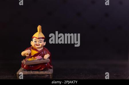 Creative work, Handmade idol of tibetan Monk playing an instrument with ...