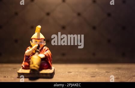 Creative work, Handmade idol of tibetan Monk playing an instrument with ...