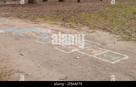 children's game on the asphalt, numbers are painted on the asphalt with paint Stock Photo