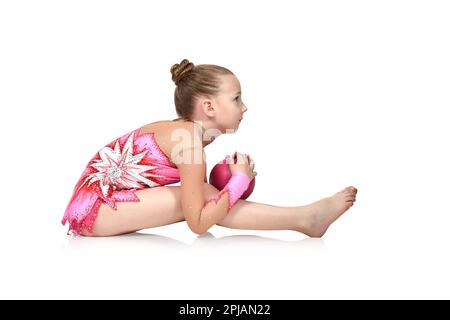 Little girl gymnast with pink ball Stock Photo