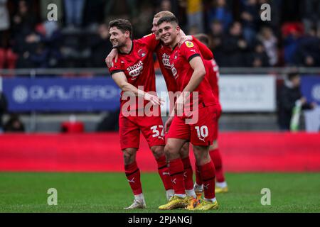 (left to right) Leyton Orient's Rob Hunt, Jordan Brown and Ruel Sotiriou celebrate after the Sky Bet League Two match at Brisbane Road, London. Picture date: Saturday April 1, 2023. Stock Photo