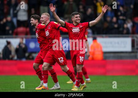 (left to right) Leyton Orient's Rob Hunt, Jordan Brown and Ruel Sotiriou celebrate after the Sky Bet League Two match at Brisbane Road, London. Picture date: Saturday April 1, 2023. Stock Photo