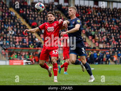 Leyton Orient's Rob Hunt (left) and Carlisle United's Jack Armer battle for the ball during the Sky Bet League Two match at Brisbane Road, London. Picture date: Saturday April 1, 2023. Stock Photo