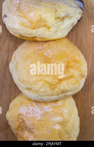 Set of photographic breads, round, on a wooden background, white background. Stock Photo