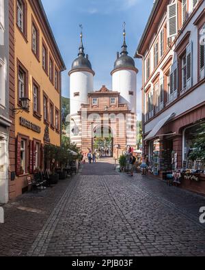 Typical pedestrian street of Heidelberg old town leading to Old Bridge gate. Heidelberg, Baden-Württemberg, Germany, Aug. 2022 Stock Photo