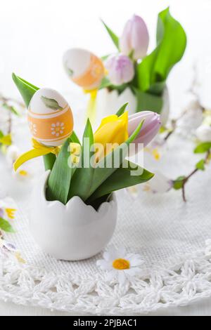 Easter table setting with painted eggs Stock Photo