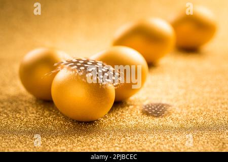 Golden eggs on golden background for Easter Stock Photo
