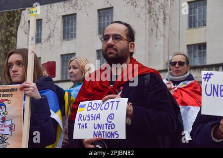 London, UK. 01st Apr, 2023. A protester holds a placard which states 'Boycott Russia at the United Nations' during the demonstration outside Downing Street. Pro-Ukraine demonstrators gathered in protest against Russia taking over the presidency of the UN Security Council for the month of April. Credit: SOPA Images Limited/Alamy Live News Stock Photo
