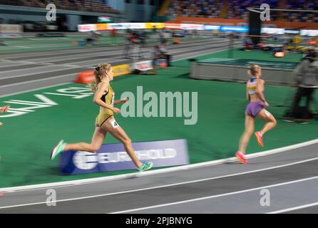 Keely Hodgkinson of Great Britain & NI and Majtie Kolberg of Germany competing in the women’s 800m heats at the European Indoor Athletics Championship Stock Photo