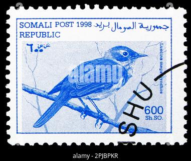 MOSCOW, RUSSIA - MARCH 26, 2023: Postage stamp printed in Somalia shows Nightingale (Luscina megarhynchus), serie, circa 1998 Stock Photo