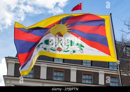 London, UK. 10th March, 2023. A Tibetan national flag is pictured flying in front of the Chinese embassy and national flag of the People's Republic of China on Tibetan National Uprising Day. Tibetan National Uprising Day commemorates the 1959 Tibetan uprising against China's invasion and occupation of Tibet. Credit: Mark Kerrison/Alamy Live News Stock Photo