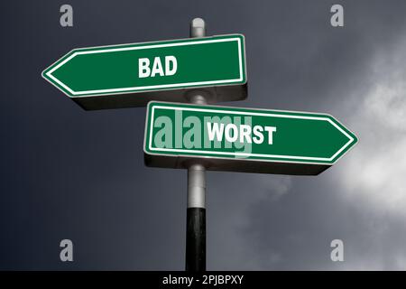 Two direction signs, one pointing left (Bad), and the other one, pointing right (Worst). Stock Photo