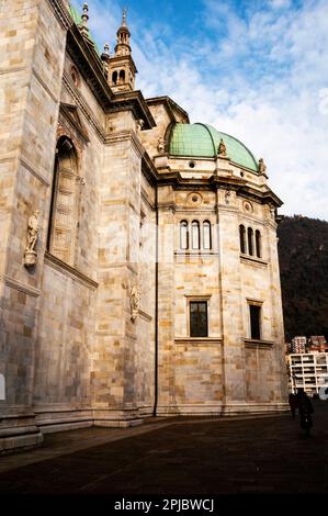 Romanesque style arch, pedimented windows and dome of the Duomo di Como, Italy. Stock Photo