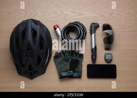 Flat lay composition with different cycling accessories on wooden background Stock Photo