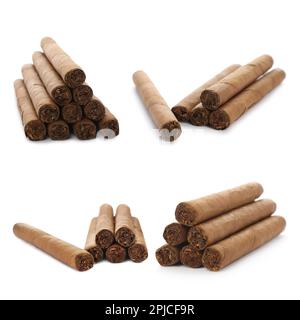 Set of cigars wrapped in tobacco leaves on white background Stock Photo