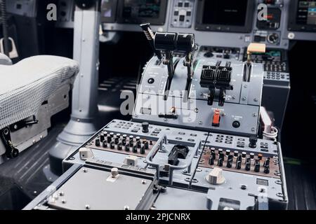 Knobs and buttons. Close up focused view of airplane cockpit Stock Photo