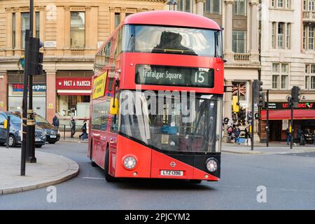 London, UK -February 27, 2023; London double decker bus leaning at Trafalgar Square roundabout Stock Photo