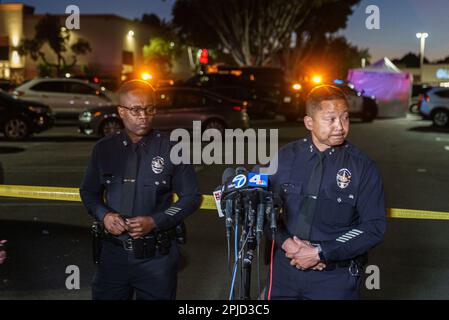 Los Angeles Police Valley Bureau Deputy Chief Alan Hamilton, right, and  Topanga Community Police Station Capt. Francis Boateng brief the media  after a fatal shooting in a shopping mall parking lot, in