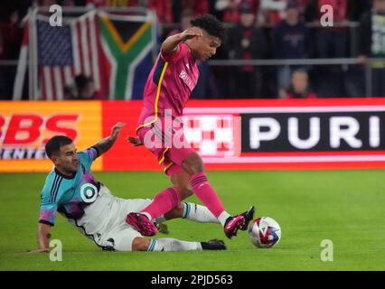 St. Louis, United States. 01st Apr, 2023. St. Louis SC Niko Gioacchini (R) can't get to the ball first as he is upended by Minnesota United Kemar Lawrence in the first half at City Park in St. Louis on Saturday, April 1, 2023. Photo by Bill Greenblatt/UPI Credit: UPI/Alamy Live News Stock Photo