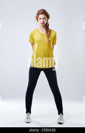 Keeping it casual. Studio shot of a casually dressed young woman. Stock Photo