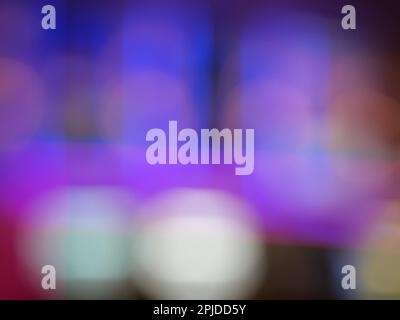 Night city light bokeh background for the celebration of the holiday season, Colorful light circles spread on blue with purple with yellow and red Stock Photo