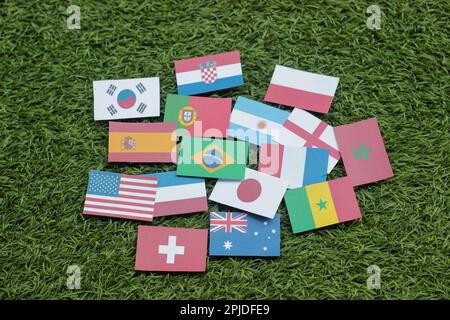 Leather soccer ball with international team flags of the participating countries in the championship tournament isolated on white background. Football Stock Photo