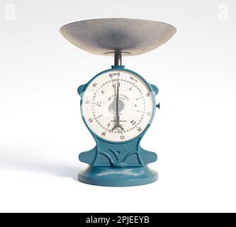 A vintage cast iron weight scale on a white isolated background - 3D render Stock Photo