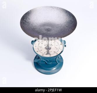 A vintage cast iron weight scale on a white isolated background - 3D render Stock Photo