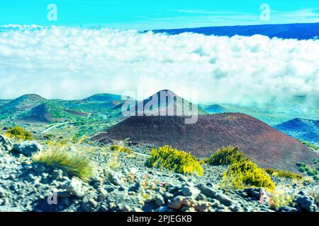 Beauty of the Mauna Kea valley landscape as seen from above with thick white clouds on the horizon. Stock Photo