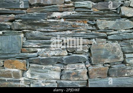 Old Rough Stone Block Wall of the Country House in Eurasia Stock Photo