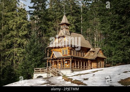 Zakopane style chapel called 'Jaszczurówka'. A small wooden chapel covered with shingles. Zakopane, Poland Stock Photo