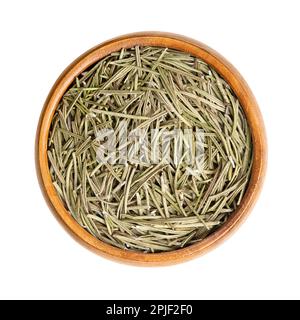 Dried rosemary leaves in a wooden bowl. Salvia rosmarinus, an aromatic and evergreen shrub, with fragrant and needle-like, green leaves. Stock Photo