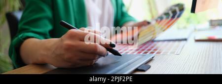 Professional female interior designer or graphic designer working on project Stock Photo