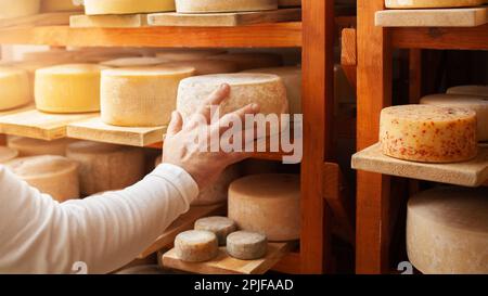 Cheese ripens on shelves in a cave in Switzerland Stock Photo - Alamy