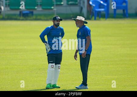 Litton Kumar Das (L) and Head Coach Chandika Hathurusingha during Bangladesh Test Cricket Team attends practice session ahead of their alpne Test matc Stock Photo