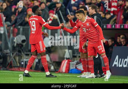 Alphonso DAVIES, FCB 19 Lionel Messi, PSG 30 change jersey after the eighth  finals match PARIS SG - FC BAYERN MUENCHEN 0-1 of football UEFA Champions  League, match in season 2022/2023 in