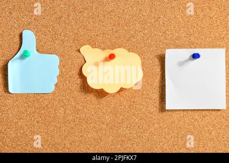 Pinned sticky notes on board Stock Photo
