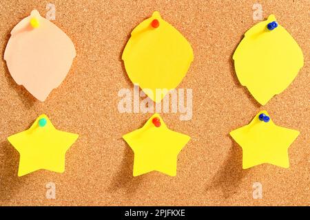 Pinned sticky notes on board Stock Photo