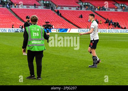 Eoin Toal (18 Bolton Wanderers) with head in shirt after the lose ...