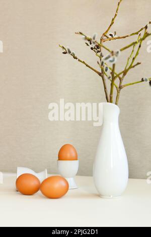 brown easter eggs on the table. Eggs chicken on beige background Stock Photo