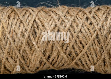 Natural jute twine skein, close-up. Spool of linen rope texture on the background Stock Photo