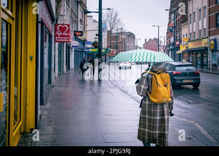 London- February 2023: Streatham High Street scene on a rainy day Stock Photo