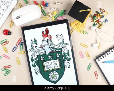 In this photo illustration,  University of Leeds  logo seen displayed on a tablet. Stock Photo